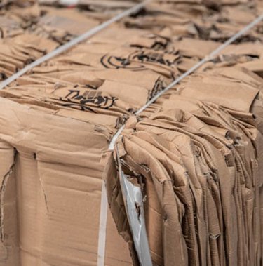 Cardboard bale illustrating the concept of earning money from recycling cardboard