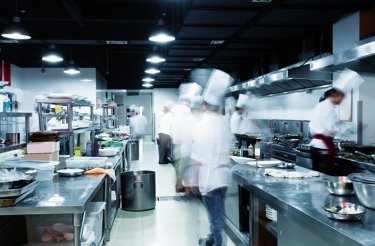 chefs in busy kitchen environment