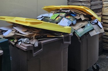 cardboard waste in containers back of house of a retail store
